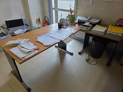 an image of a desk with a lot of papers on it