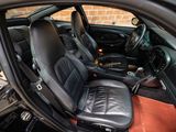 a picture of the inside of a car with leather seats