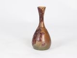 an image of a brown vase sitting on top of a white surface