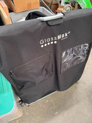 a black shirt that is sitting on top of a cart