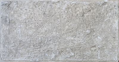 a stone block with a drawing on it on the wall