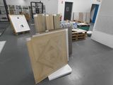 a room with a lot of boxes and pictures on the wall