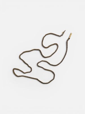 a snake that is laying down on a white surface