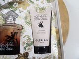 a bottle of perfume and a bottle of body lotion in a box