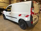 a white van parked in a garage with other vehicles
