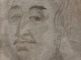 dessin représentant le visage d'un homme sur une feuille de papier