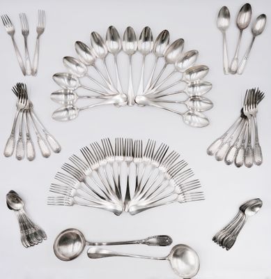 a lot of silver spoons and spoon spoons on a table