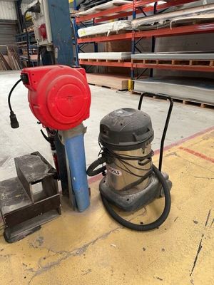 a machine that is sitting on the floor in a warehouse