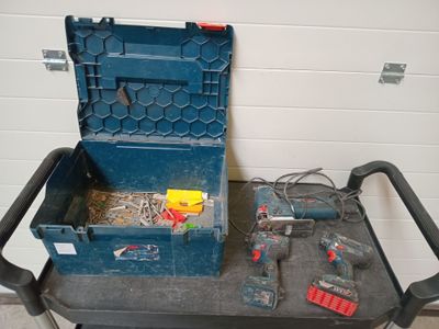 a blue tool box sitting on top of a cart