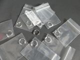 a lot of clear bags with a keychain on them