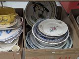 many plates and bowls in a box on the table