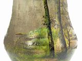 a vase that has a picture of a bird on it