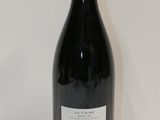 a bottle of wine that is sitting on a table