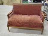 a red couch that is sitting in a room