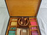 a wooden box filled with different types of soaps