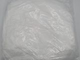 a bag of white toilet paper sitting on a table