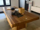 a large wooden table in the middle of a room