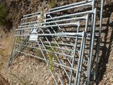 a metal fence that has been placed on the side of the road