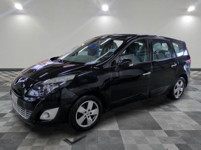 a picture of a black minivan parked on a checkered floor