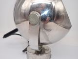a silver lamp that is on top of a table