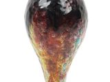 a glass vase that is sitting on top of a table