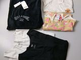 three t - shirts are laid out on a table with a price tag
