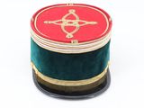 a red and green box on a black stand