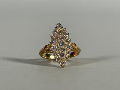 a close up of a gold ring with diamonds on it