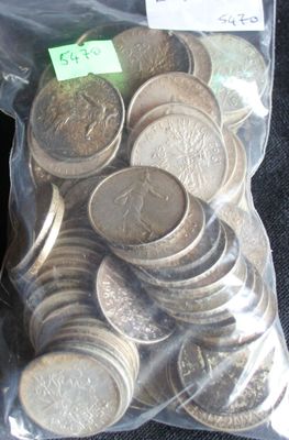 a bag full of coins sitting on a table