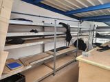 a room filled with shelves and shelves with bags on them