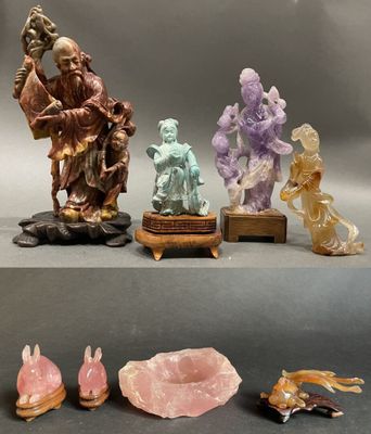 several figurines of different shapes and sizes are displayed on a table