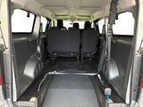 the back of a van with the doors open and the seats down