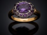 an amethorate and diamond ring set in 18k yellow gold