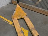 a pair of skis laying on the ground in a parking lot