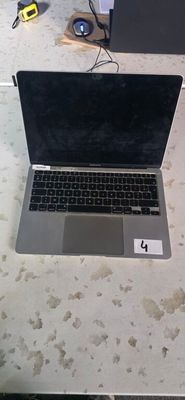 a laptop computer sitting on a table with a mouse on it