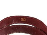 a close up of a red leather belt on a white background