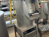 two industrial mixers that are sitting in a room