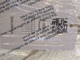 a label on a piece of plastic that is attached to a piece of fabric