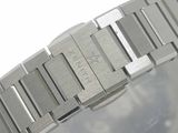 a close up of a watch on a white surface
