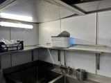 a picture of a kitchen with a sink and a lot of counter space