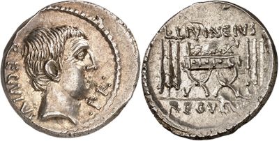 a silver coin with an image of a man on it