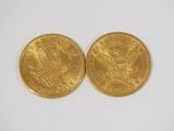 two gold sovereigns, one of which is a sovereign and the other is a sovereign