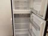 an open refrigerator that is sitting on a pallet