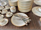a lot of plates and cups on the table