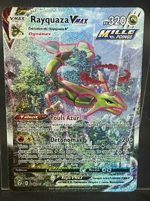 a close up of a pokemon card with a lizard on it
