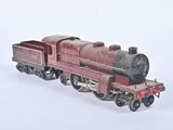 a toy train on a white surface with a white background