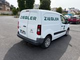 a white van that is parked in a parking lot