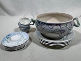 a bowl and a plate with a spoon on a table