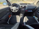 the interior of a small car with black leather seats and a steering wheel