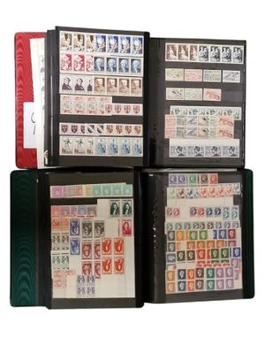a lot of stamps in a binder on the table